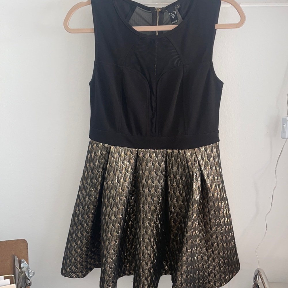 Black and gold flounced dress